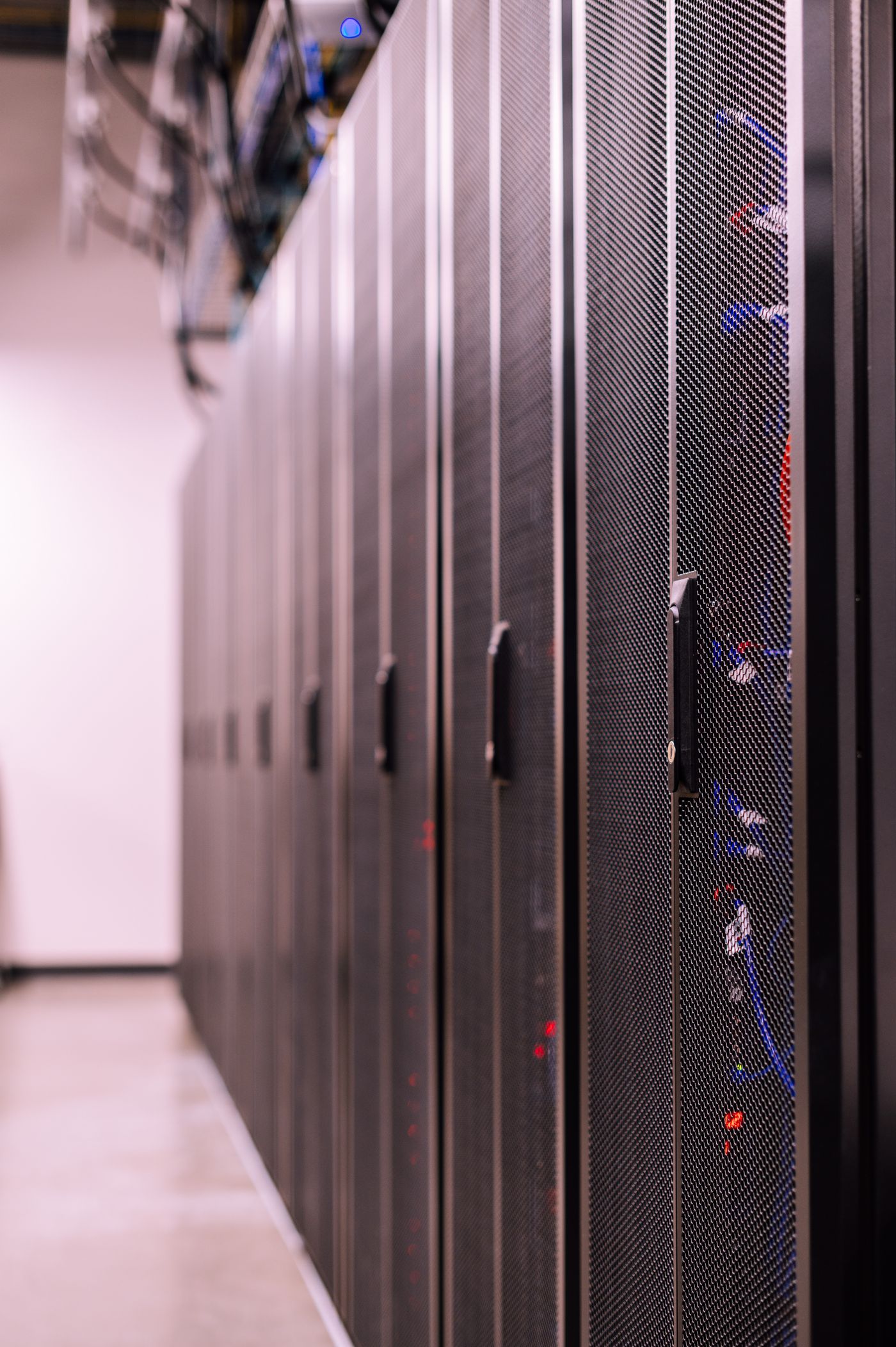Server racks in a data center aisle
